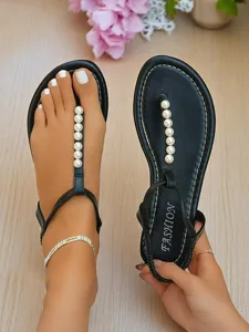 women-s-black-pearl-t-strap-flat-sandals-default-1